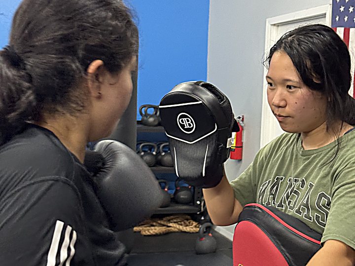Women's pad work at Laguna Muay Thai