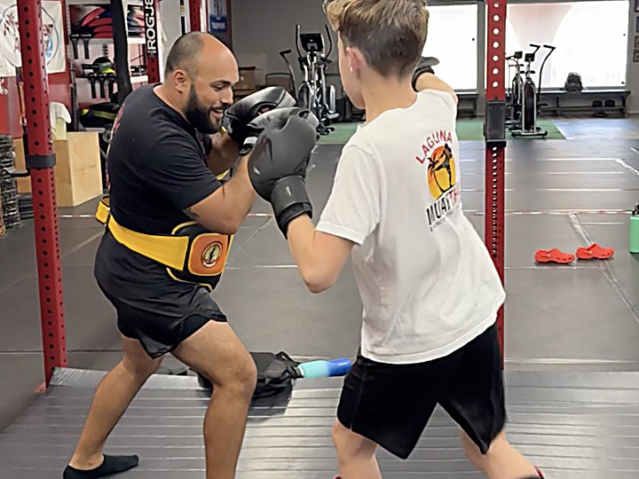 Knee strikes on the belly pad at Laguna Muay Thai