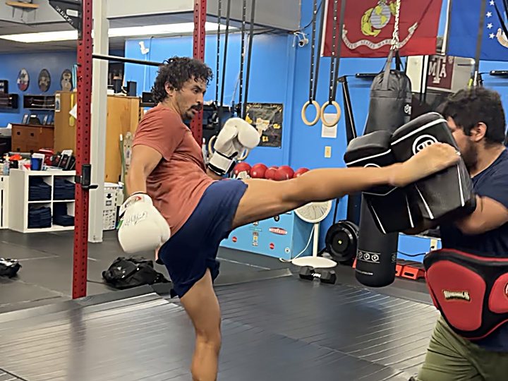 Adult Muay Thai high kick at Laguna Muay Thai