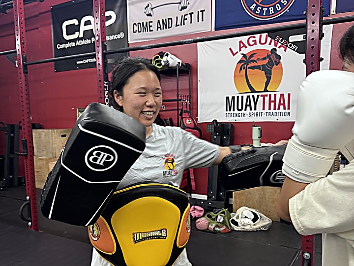 A student smiling during training at Laguna Muay Thai