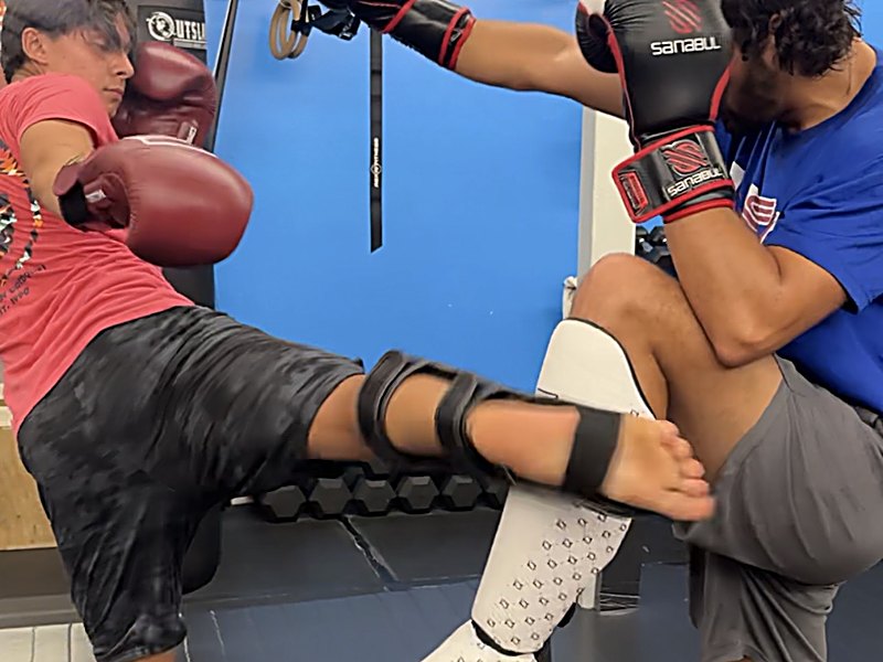 Adult Muay Thai sparring and defense at Laguna Muay Thai